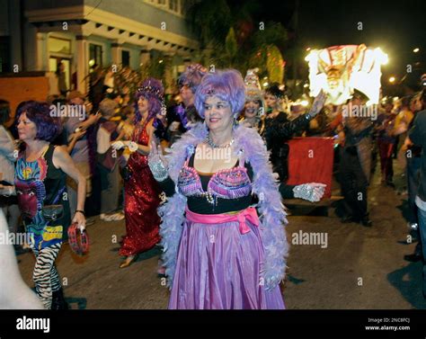 Members Of The Krewe Du Vieux Parade Through The Streets Of New Orleans