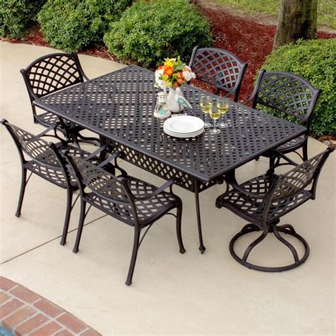 Heritage Piece Cast Aluminum Patio Dining Set With Swivel Rockers