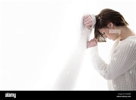 Sad Pretty Brunette Leaning Against Wall Stock Photo Alamy