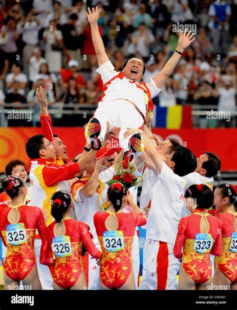 The Chinese women's gymnastics team celebrates for the first ever ...