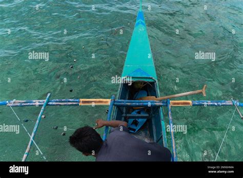 Top View Of Filipino Fisherman Collecting Fishing Net Philippines