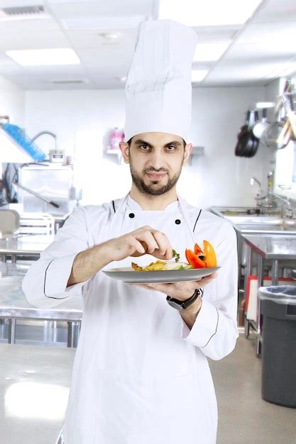 Premium Photo | Italian chef preparing dish in the kitchen