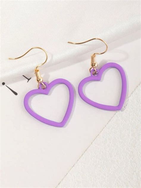 pair of heart shaped earrings on white background