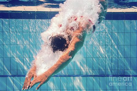 Swimmer Diving Into Pool Photograph By Microgen Images Science Photo