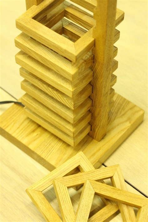 A Stack Of Wooden Squares Sitting On Top Of A Table