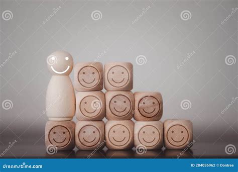 Happy Wooden Human Figure Peg Dolls With Many Smile Icons On Wooden