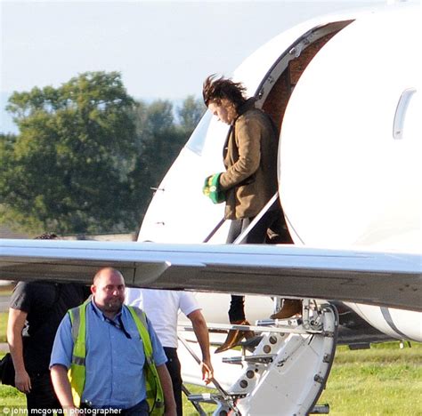 Harry Styles And One Direction Band Mates Arrive At Glasgow Airport In