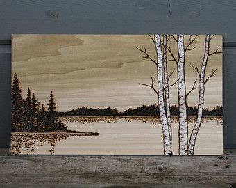 An Acrylic Painting Of Birch Trees By The Water On A Wood Paneled Wall