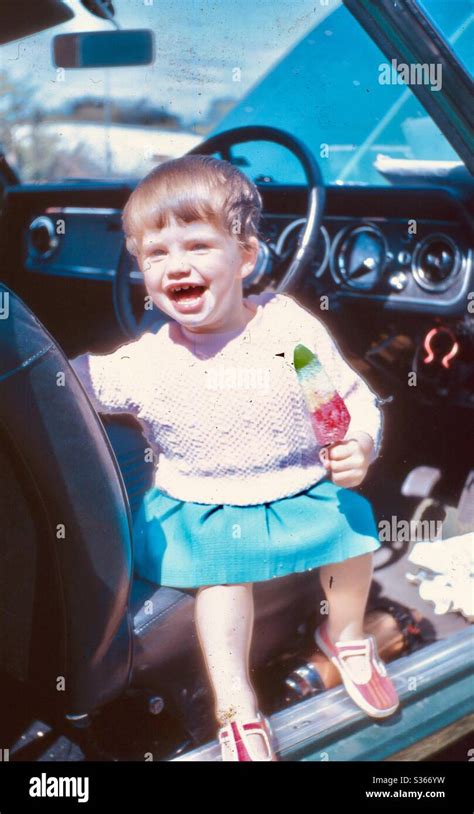 Smiling girl with ice cream Stock Photo - Alamy