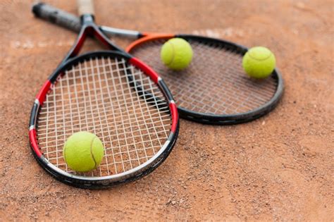 Free Photo Tennis Rackets With Balls On The Court