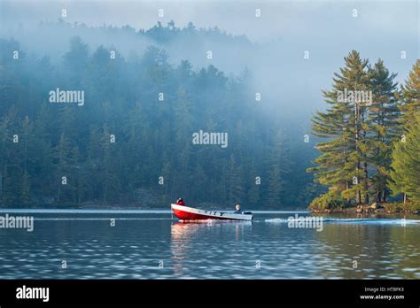 A Boat On Charlton Lake At Dawn Ontario Canada Stock Photo Alamy