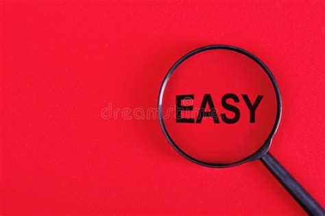 Magnifying Glass Over Word Easy On Red Background Stock Image Image