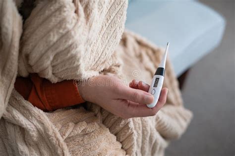 Close Up Shot Of A Man Looking At Thermometer Male Hands Holding A