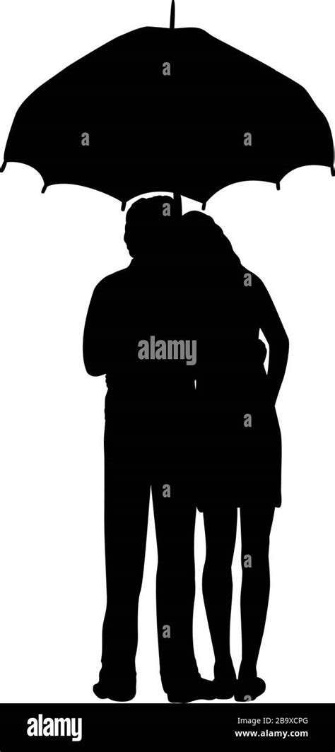 Silhouette Of Two Lovers Man And Woman Stand Under Umbrella Stock