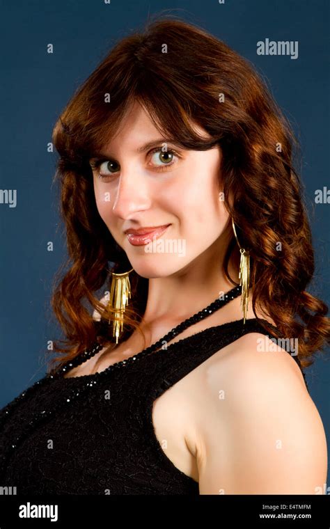 Beautiful Brunette Black Dress On A Dark Background Stock Photo Alamy