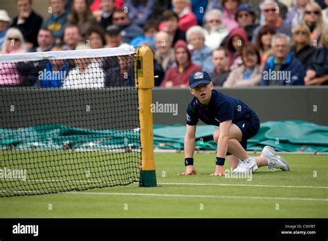 Ball Boy By The Net On Court 1 During The 2011 Wimbledon Tennis