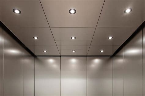 Elevator Ceiling In Stainless Steel With Seastone Pattern Shown In