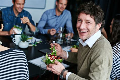 Enjoying Lunch With Colleagues And Friends Portrait Of An Office