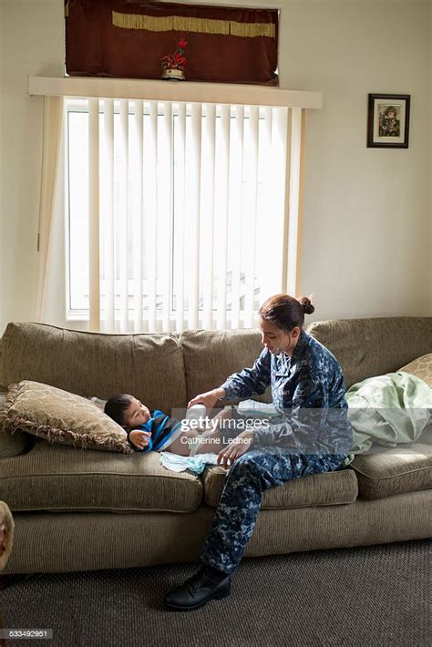 Navy Mom Changing Sons Diaper High Res Stock Photo Getty Images