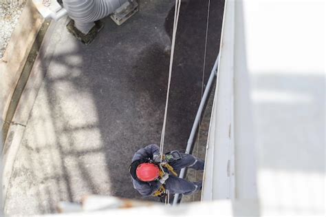 Premium Photo Male Worker Rope Access Height Safety Inspection Of