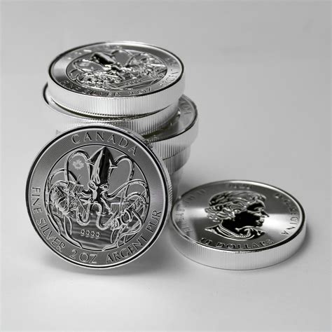 Assorted Silver-and-gold-colored Coins on Gray Surface · Free Stock Photo