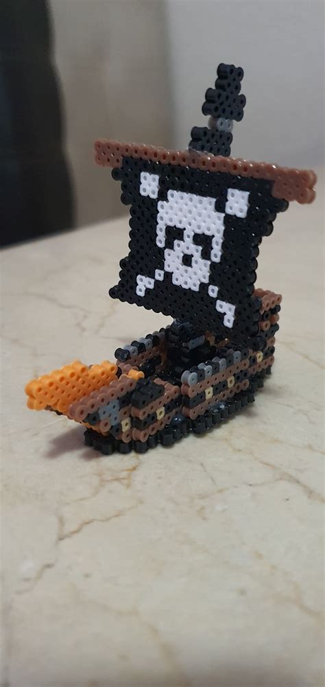 an image of a pixel art figure made out of legos on a counter top