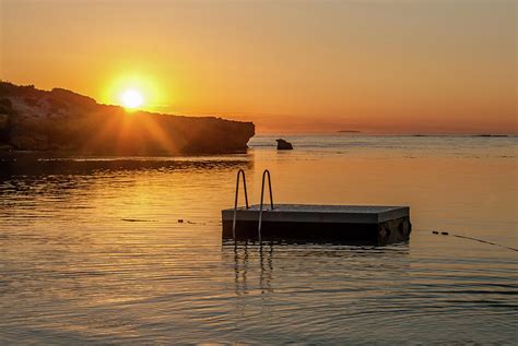 Sunset at the Beach with Pontoon Photograph by Anne Schneyder - Fine Art America