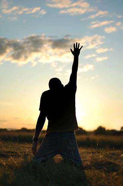 Man Praying On Knees Pictures Images And Stock Photos Istock