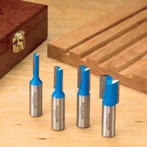 Four Blue And Silver Screwdrivers Sitting Next To A Wooden Box