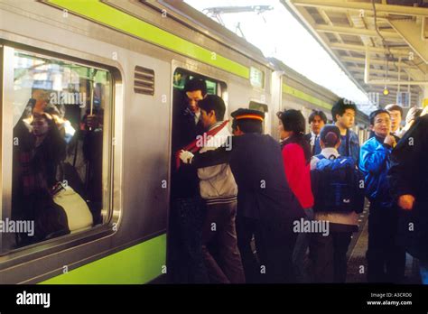 Asia Japan Tokyo Shinjuku station rush hour crowded crowds commuters ...