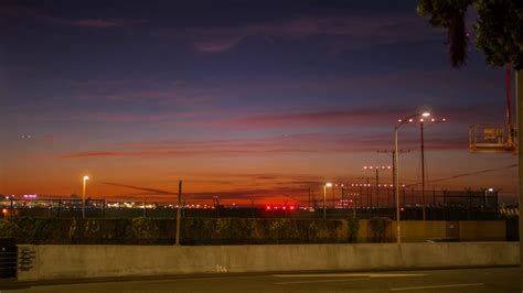 Time lapse of LAX airport with jet planes runway take off at night in ...