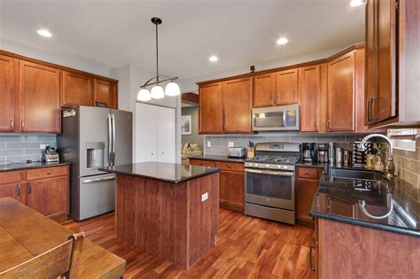 Gorgeous Kitchen Boasts Maple Cabinets Granite Counters