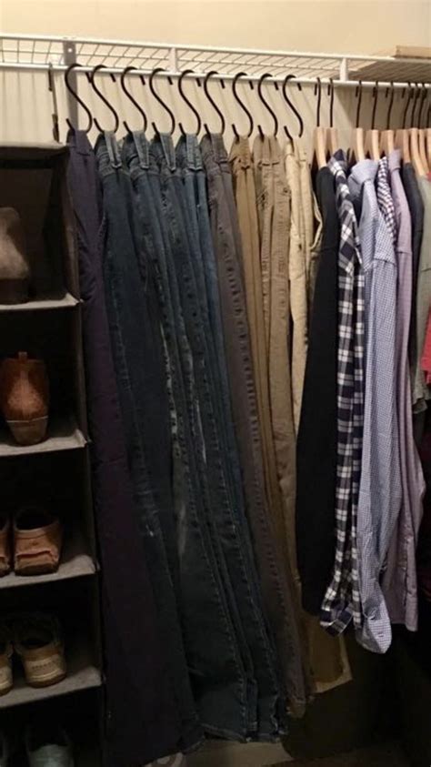 An Organized Closet With Clothes And Shoes