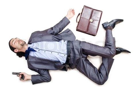 Dead businessman on the floor | Stock Photo | Colourbox