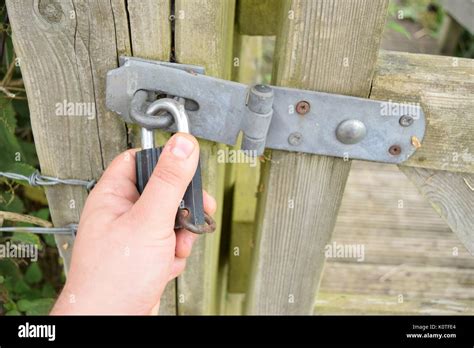 Padlock on a wooden gate Stock Photo - Alamy