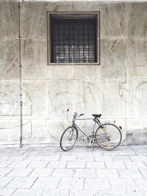 Premium Photo Bicycle Parked Against Wall