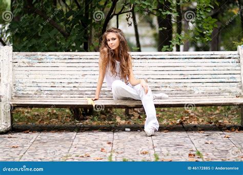 Beautiful Woman Sitting On A Bench In Autumn Park Stock Image Image