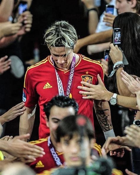 The Soccer Player Is Surrounded By His Fans