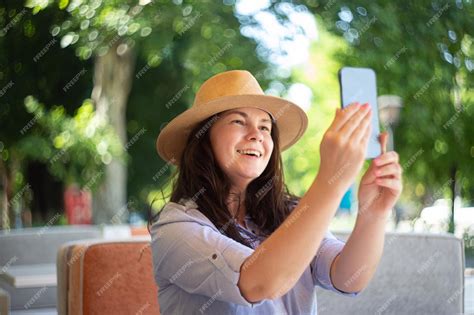 Premium Photo Smiling Woman Making Selfie Outside