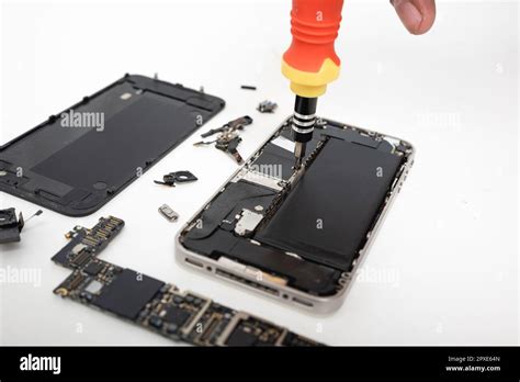 Technician Repairing Inside The Smartphone Motherboard With Tools For Recovery The Man Repair