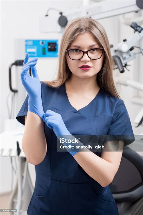 Portrait Of Young Female Dentist At The Modern Dental Office Doctor