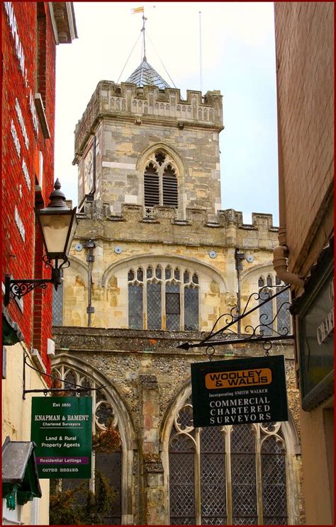 An Old Brick Building With A Clock Tower