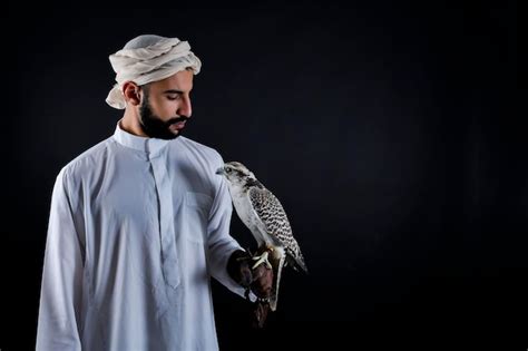 Premium Photo Young Arab Prince Holding A Bird Of Prey