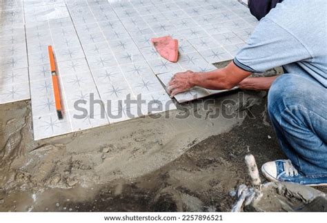 Worker Placing Ceramic Floor Tiles On Stock Photo Shutterstock