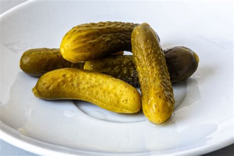 Pickled Gherkins Are On A White Plate Isolated Stock Image Image Of