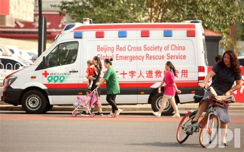 Photo A China Red Cross Ambulance Is Parked In Beijing China