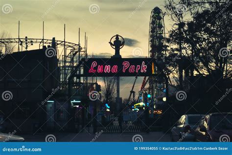 Lighted Up Signboard Of Luna Park With Ferris Wheel And Other Toys On