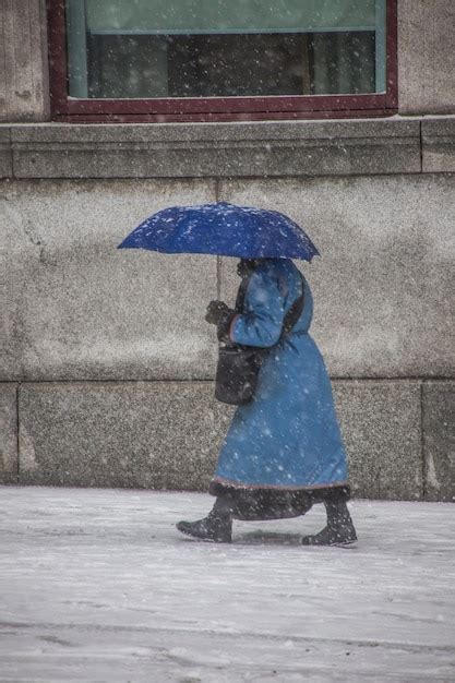 Premium Photo Man Holding Umbrella In Rain