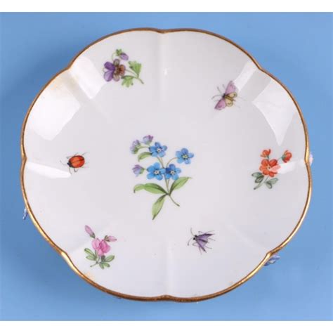 A 19th Century Meissen Flower Encrusted Cabinet Cup And Saucer