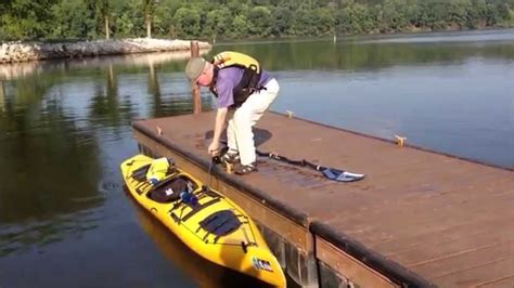 Getting Into A Canoe From A Dock Rapids Riders Sports